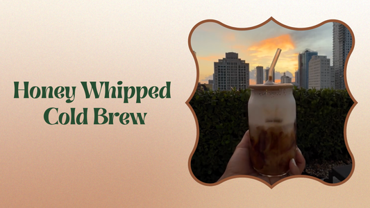 Honey whipped cold brew in a glass with creamy foam and ice cubes